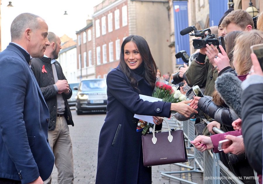 Meghan Markle in Nottingham, carrying her Strathberry handbag