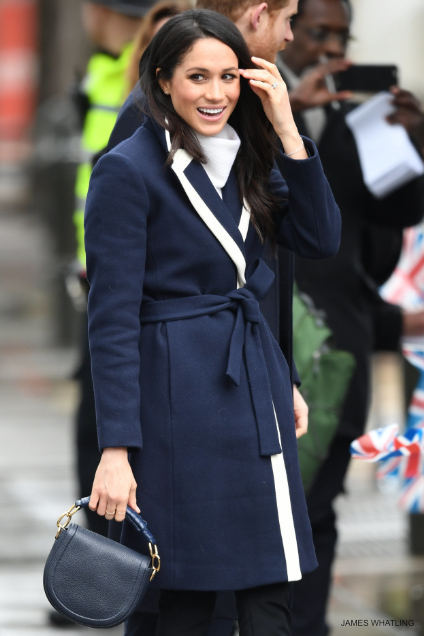 Megham Markle wearing her J.Crew coat in navy blue with white detailing