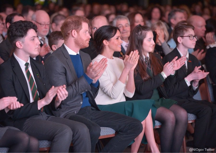 Meghan and Harry watching performances